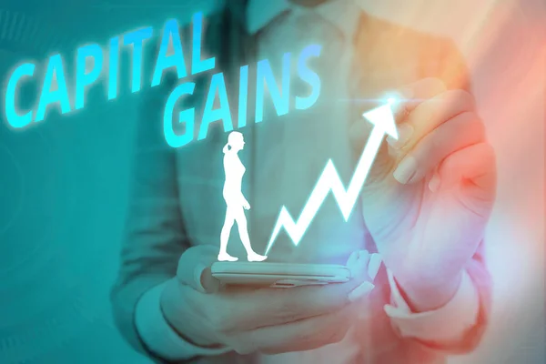 Handwriting text writing Capital Gains. Concept meaning Bonds Shares Stocks Profit Income Tax Investment Funds.