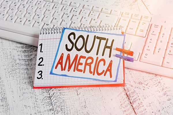 Text sign showing South America. Conceptual photo Continent in Western Hemisphere Latinos known for Carnivals notebook paper reminder clothespin pinned sheet white keyboard light wooden. — Stock Photo, Image