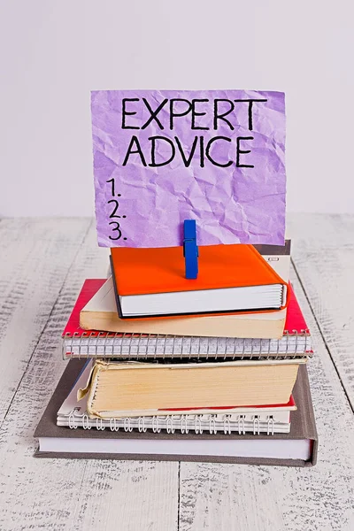 Handwriting text Expert Advice. Concept meaning Sage Good Word Professional opinion Extensive skill Ace pile stacked books notebook pin clothespin colored reminder white wooden. — Stock Photo, Image