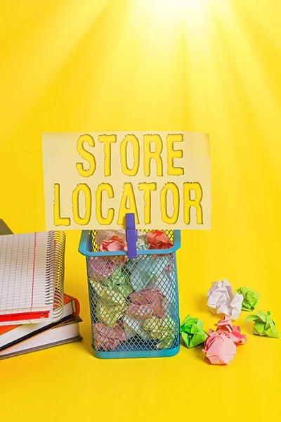 Writing note showing Store Locator. Business photo showcasing to know the address contact number and operating hours Trash bin crumpled paper clothespin office supplies yellow.