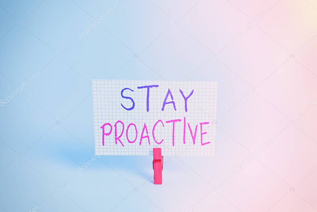 Conceptual hand writing showing Stay Proactive. Business photo showcasing Taking own decision to go ahead of anticipated events Colored clothespin rectangle shaped paper blue background.