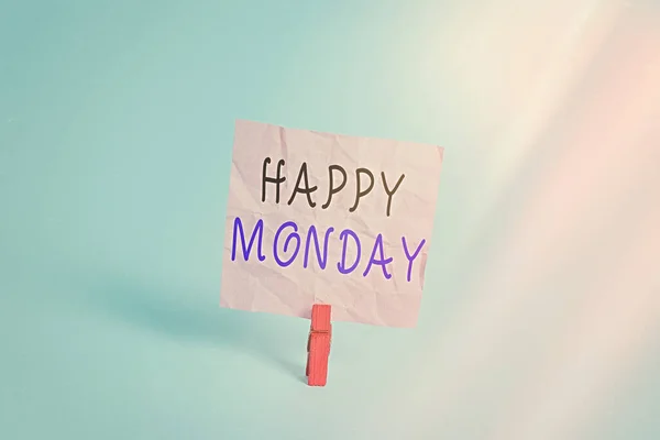 Writing note showing Happy Monday. Business photo showcasing telling that an individual order to wish him great new week Colored clothespin rectangle square shaped paper light blue background.