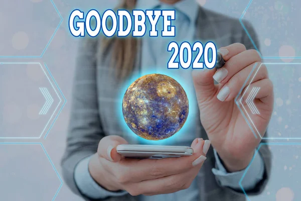 Написано текст Good Bye 2020. Концепція означає виражати добрі побажання під час розлучення або в кінці минулого року Елементи цього зображення, надані НАСА.. — стокове фото