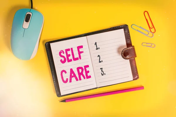 Writing note showing Self Care. Business photo showcasing practice of taking action to preserve or improve ones own health Leather locked diary striped sheets marker mouse colored background. — Stock Photo, Image