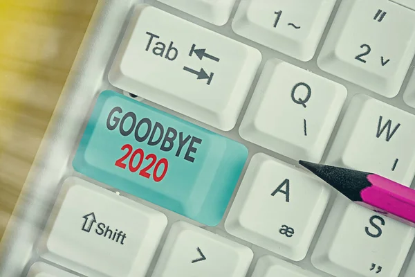Writing note showing Good Bye 2020. Business photo showcasing express good wishes when parting or at the end of last year.