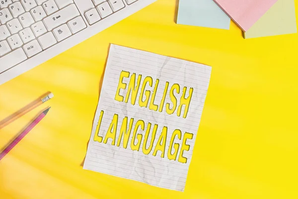 Word pisanie tekstu Język angielski. Business concept for third spoken native lang in world after Chinese and Spanish Copy space on notebook above yellow background with pc keyboard on the table. — Zdjęcie stockowe