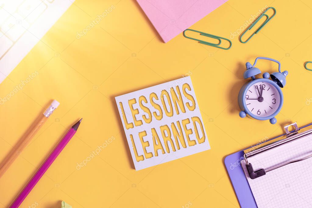 Conceptual hand writing showing Lessons Learned. Business photo showcasing experiences distilled project that should actively taken Flat lay above copy space on the white crumpled paper.