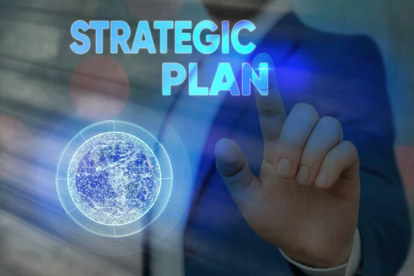 Conceptual hand writing showing Strategic Plan. Business photo text a systematic process of envisioning a desired future Elements of this image furnished by NASA. — Stock Photo, Image