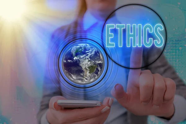 Writing note showing Ethics. Business photo showcasing the moral philosophy or code of morals practiced by an individual Elements of this image furnished by NASA. — Stock Photo, Image