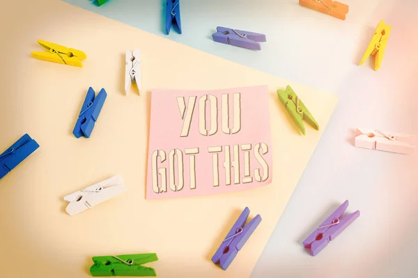 Writing note showing You Got This. Business photo showcasing to encourage someone to succeed in dealing with something Colored clothespin paper reminder with yellow blue background.