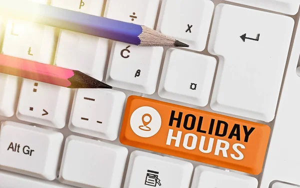 Word pisanie tekstu Holiday Hours. Koncepcja biznesowa dla pracownika otrzymuje dwa razy normalne wynagrodzenie za wszystkie godziny. — Zdjęcie stockowe