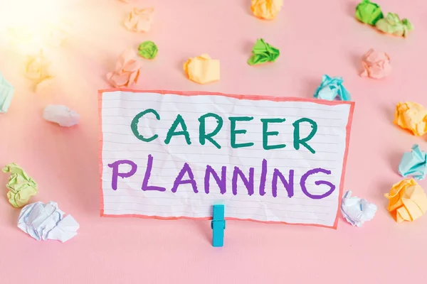Text sign showing Career Planning. Conceptual photo Strategically plan your career goals and work success Colored crumpled papers empty reminder pink floor background clothespin.