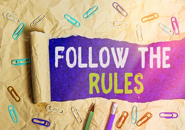 Conceptual hand writing showing Follow The Rules. Business photo text go with regulations governing conduct or procedure. — Stock Photo, Image