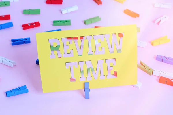 Text sign showing Review Time. Conceptual photo to think or talk about something again Set schedule to review Colored clothespin papers empty reminder pink floor background office pin. — Stock Photo, Image