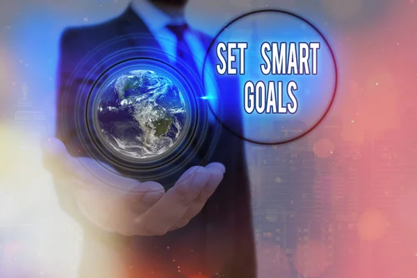 Writing note showing Set Smart Goals. Business photo showcasing giving criteria to guide in the setting of objectives Elements of this image furnished by NASA. — Stock Photo, Image