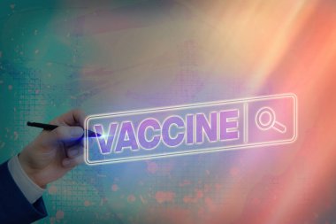 Aşıyı gösteren bir not yazıyorum. Öldürülen mikroorganizmaların ya da yaşayan zayıflamış organizmaların iş fotoğraflarının hazırlanması.