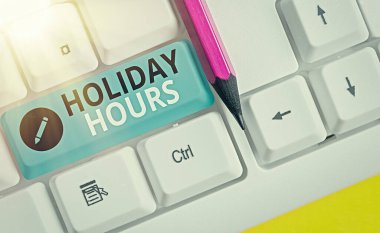 Holiday Hours 'u gösteren kavramsal el yazısı. İş fotoğrafçıları saatlerce normal ücretlerinin iki katını alıyor..