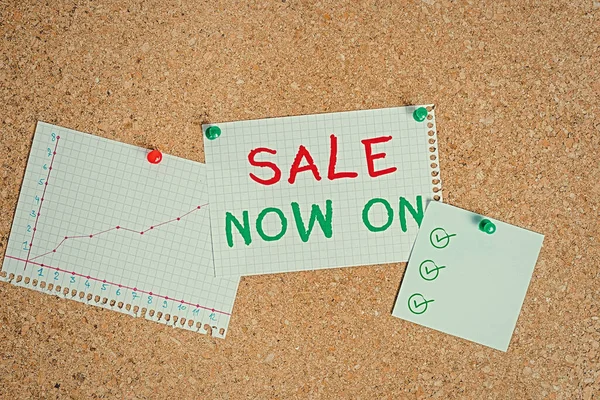 Writing note showing Sale Now On. Business photo showcasing Discounts and promotional sales retail marketing offer Corkboard size paper thumbtack sheet billboard notice board.