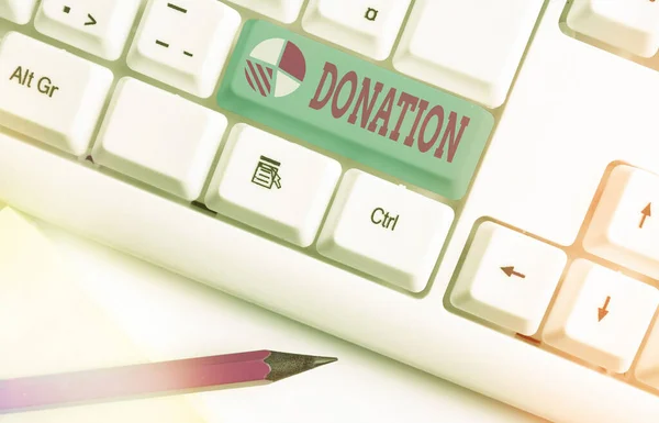 Schrijfbriefje met Donatie. Zakelijke foto presentatie van iets dat wordt gegeven aan een goed doel, vooral een som geld. — Stockfoto
