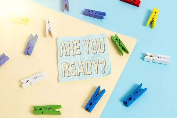 Handwriting text Are You Ready Question. Concept meaning asking someone start something when feel prepared Colored clothespin paper empty reminder yellow blue floor background office. — Stock Photo, Image