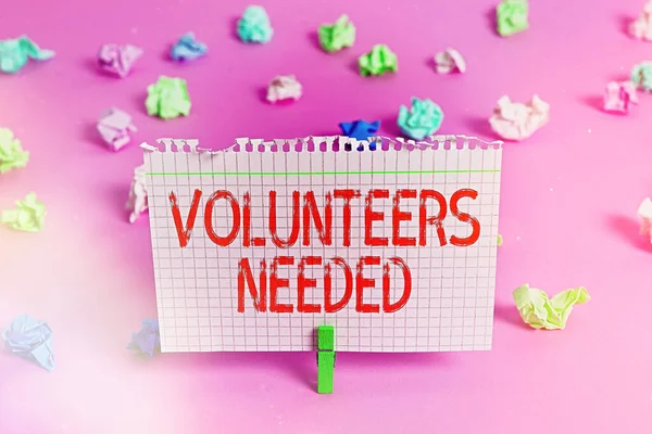 Handwriting text Volunteers Needed. Concept meaning need work or help for organization without being paid.