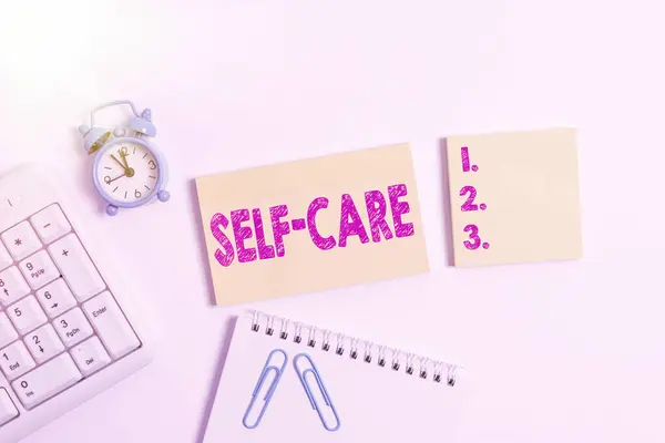 Handwriting text Self Care. Concept meaning the practice of taking action to improve one s is own health Blank paper with copy space on the table with clock and pc keyboard. — Stock Photo, Image