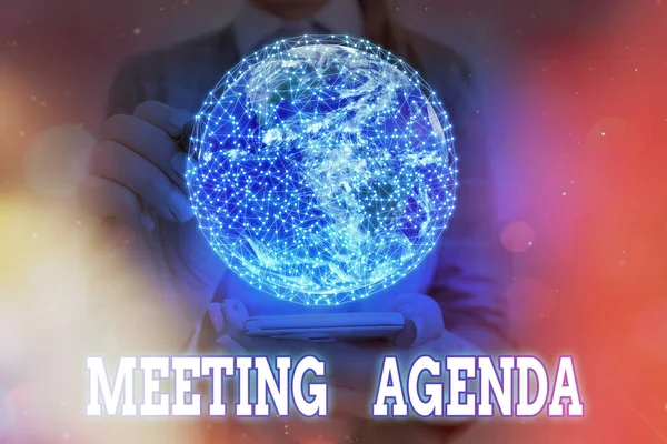 Handwriting text writing Meeting Agenda. Concept meaning items that participants hope to accomplish at a meeting Elements of this image furnished by NASA.