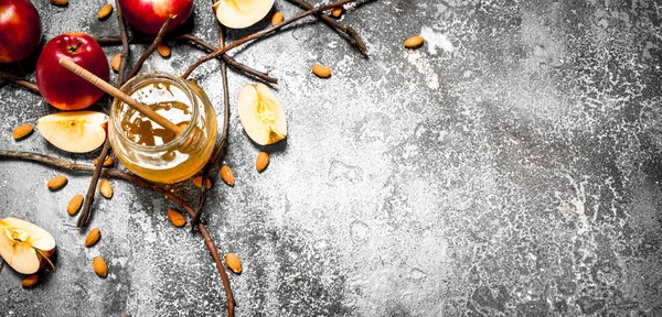 Honey background. Honey with apples and nuts.