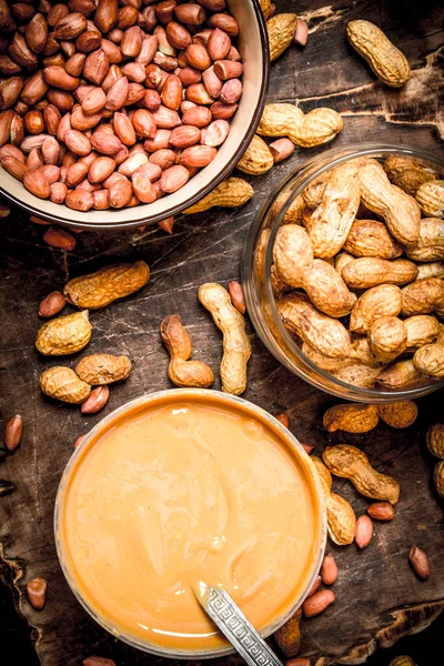 Peanut butter with nuts in a bowl.