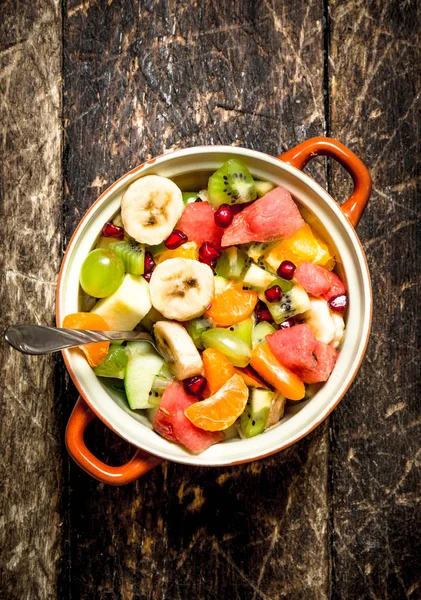 Summer food . Fruit salad in a bowl.