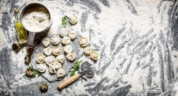 Fresh ravioli with flour and quail egg. — Stock Photo, Image