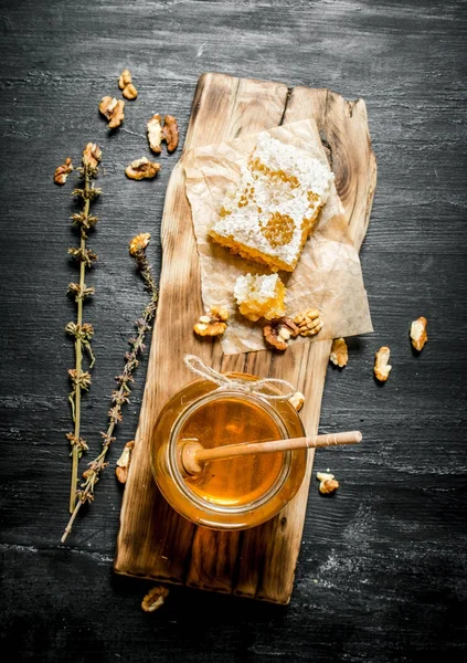 Honey background. Natural honey with herbs.