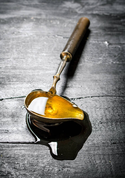 Vintage spoon with natural honey . 