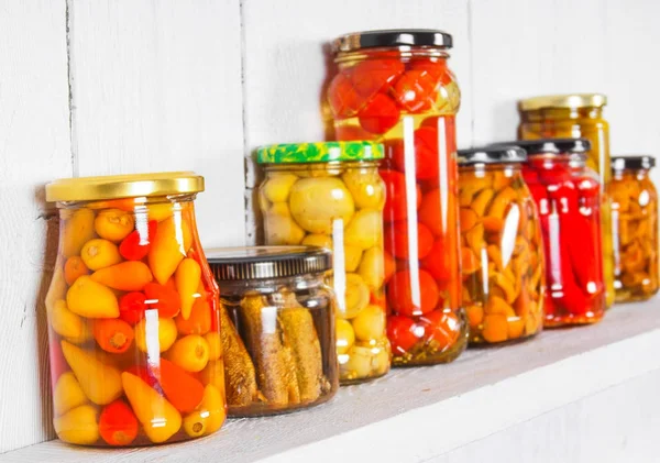 Preserved food in glass jars — Stock Photo, Image