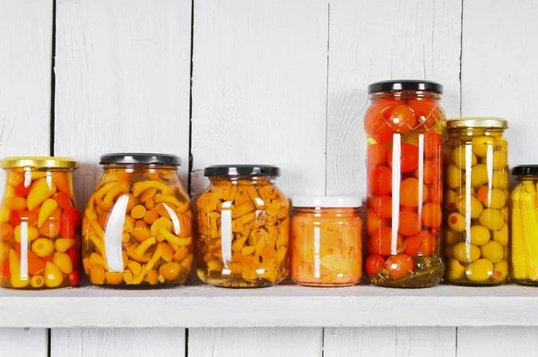 Preserved food in glass jars — Stock Photo, Image