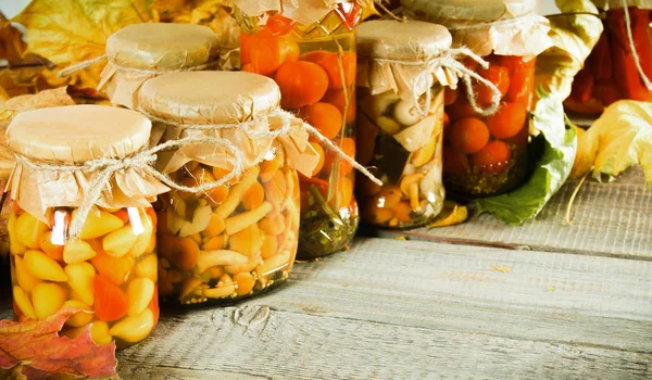 Autumn concept. Preserved food in glass jars