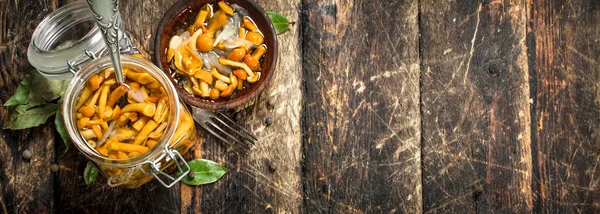 Pickled mushrooms in a bowl with spices and herbs. — Stock Photo, Image
