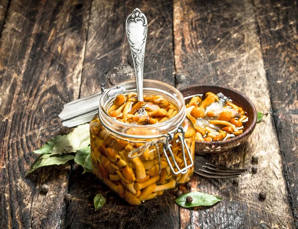 Pickled mushrooms in a bowl with spices and herbs. — Stock Photo, Image