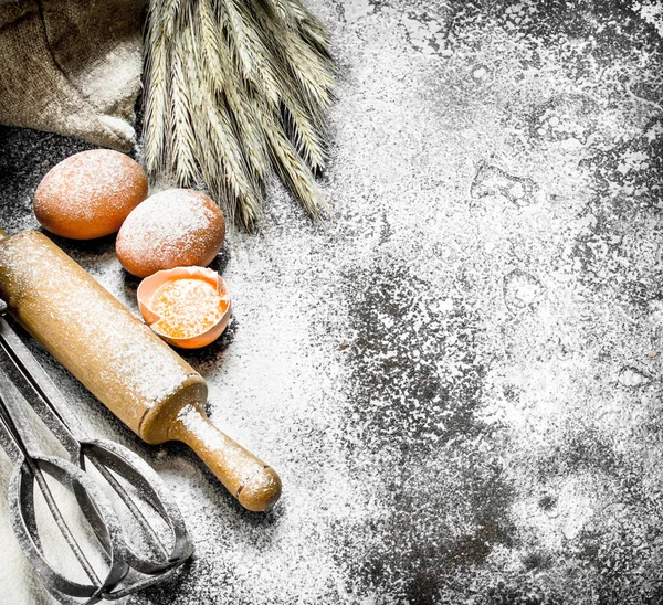 Baking background. Ingredients and tools for dough preparation.