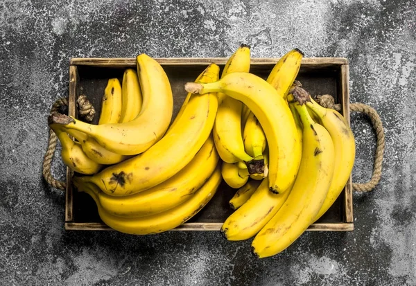 Fresh bananas on a wooden tray. — Stock Photo, Image