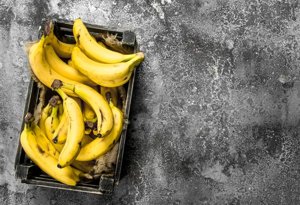 Fresh bananas in an old box. — Stock Photo, Image