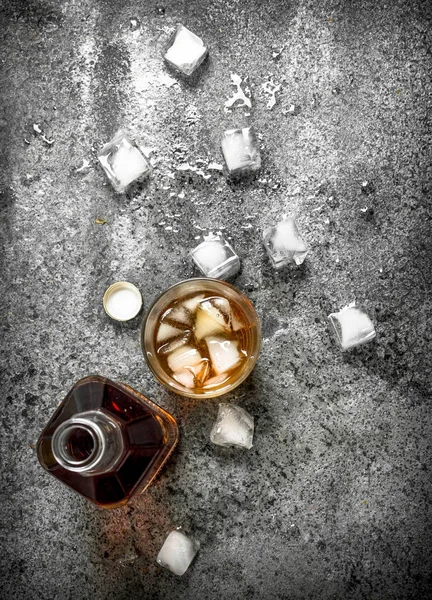 Glass of whiskey with ice cubes. — Stock Photo, Image