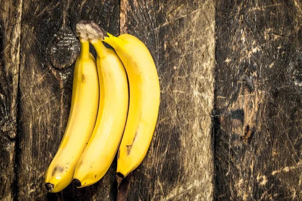 Fresh bananas. On wooden background. — Stock Photo, Image
