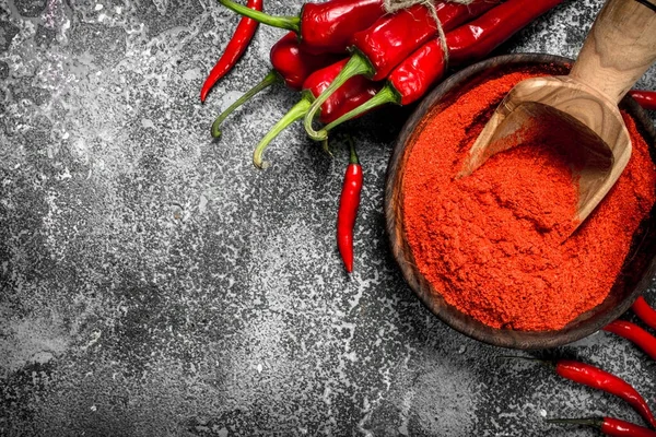 Ground chili peppers in a bowl. — Stock Photo, Image