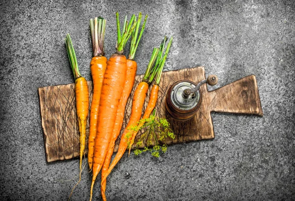 Fresh carrots on a board. — Stock Photo, Image