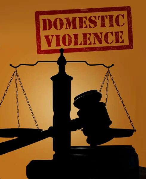 Domestic Violence and gavel with scales — Stockfoto