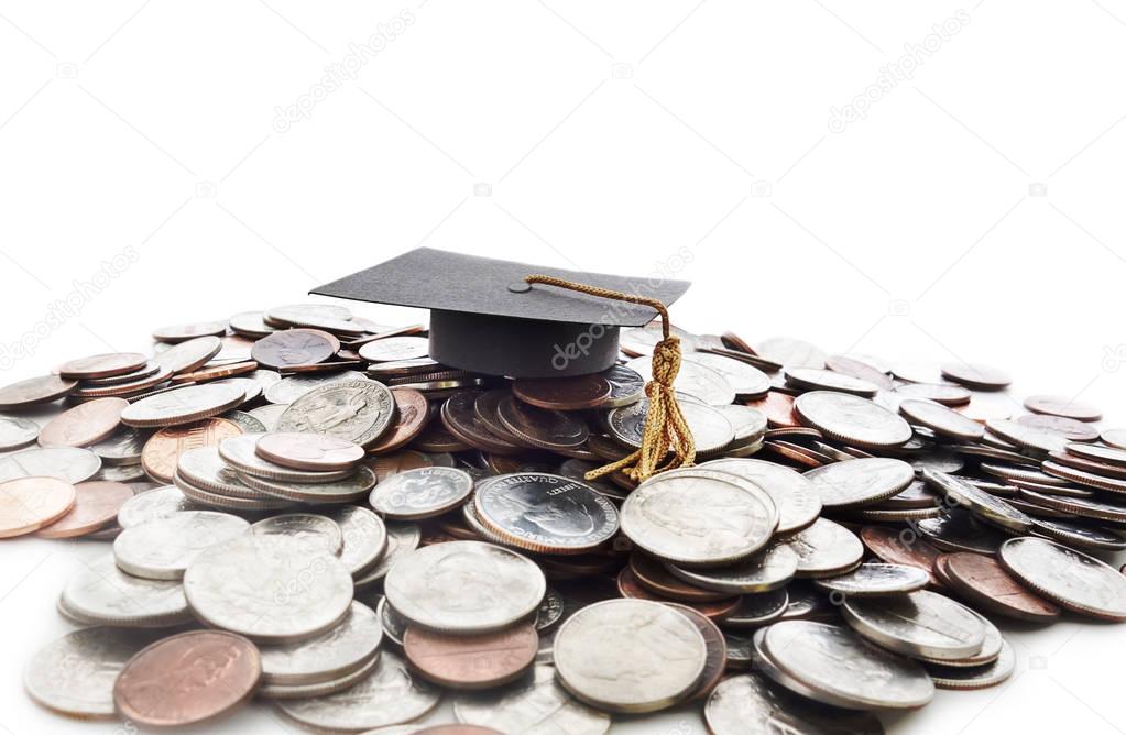 Graduation cap on money pile