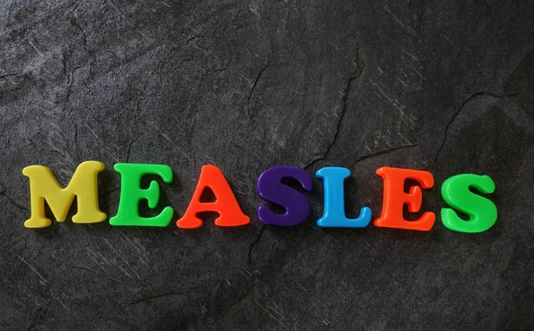 Measles letters concept — Stock Photo, Image