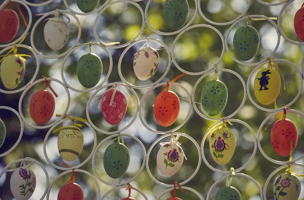 Hanging colorful decorative Easter eggs — Stock Photo, Image