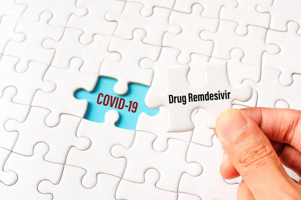 Drug Remdesivir Word White Jigsaw Puzzle Replace Covid Word Blue Stock Photo